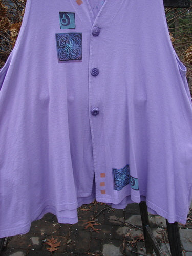 1997 Simple Vest Quad Night Atom Freesia Size 2: Swingy purple shirt with oversized knotted buttons and deep side pockets.