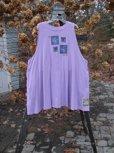 1997 Simple Vest Quad Night Atom Freesia Size 2: Swingy purple shirt with square design, deep side pockets, and oversized knotted buttons.