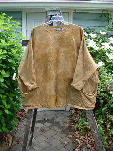 Barclay Cotton Lycra Writer's Pocket Pullover Sweatshirt in Mottled Mustard, showcasing a seamless front and back, rounded neckline, stretchy sleeves, wide square flair, and dual drop flop pockets.