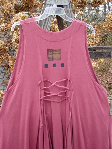 1997 Fresco Vest with square design, deep side pockets, and oversized buttons. Made from organic cotton. A-line shape, adjustable lace.