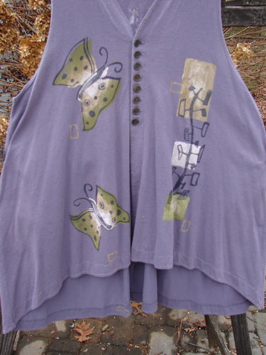 1996 Moonsmile Vest with butterfly motif on purple fabric.