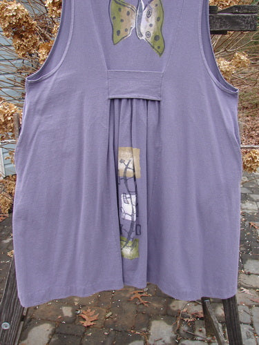 1996 Moonsmile Vest featuring a butterfly theme, made from organic cotton. Swingy and flirtatious with a V-shaped neckline, tiny buttons, and deep side seam pockets.