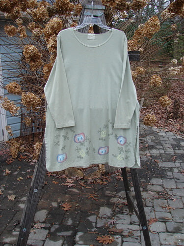 2001 Market Top with Jax Game pattern on rack, made from organic cotton. A-line shape, vented sides, drop shoulders, rounded sides. Size 1.