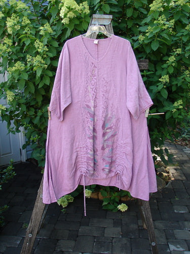 Barclay Linen High Vent Venetian Dress Center Leaf Peony Rose Size 1 on a hanger, showcasing a V-neck, elbow-length sleeves, and lacy embroidery, with hand-dyed accents near the hem.