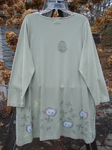 2001 Market Top with Jax Game cartoon character on long sleeves, made from organic cotton. Size 1, kelp color.