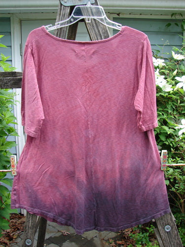 Barclay Slub Curve Bottom Tee in Mottled Magenta, featuring a rounded neckline, short sleeves, and an A-line shape with a varied hemline, embodies Bluefishfinder.com's unique vintage style.