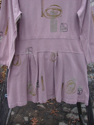1991 Workshop Dress with Spin Stone pattern, OSFA. Long-sleeved cotton dress with drop waistband, pleats, and pin tucking. Bust 40, Waist 42, Hips 48, Length 32.