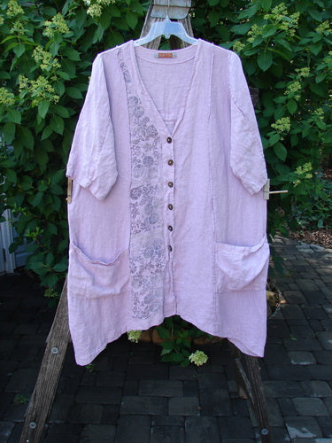Barclay Linen Double Tie Back Jacket Single Garden Row Pink Cloud Size 1 features a deep V-neck, dark buttons, and floral embroidery, hanging with a generous A-line sweep and drop flop pockets.