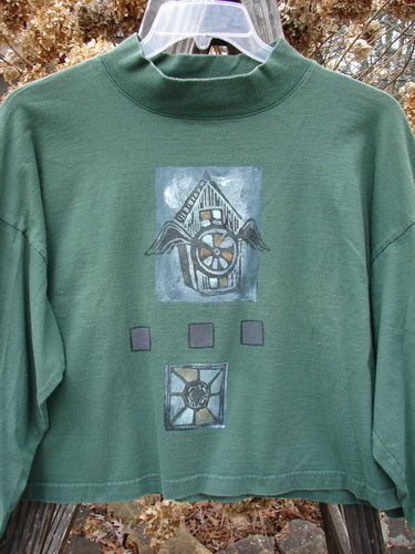 1997 Structure Tee Top with flying bird house design on verdigris green fabric.