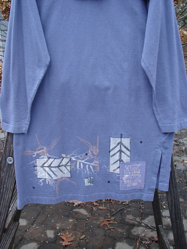 1996 Trifocal Top Arrow Stratus Size 1: Funky blue shirt with abstract arrow design, longer shape, vented sides, and folded collar.