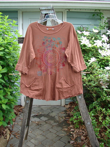 Barclay Banded Artist Pocket Top Sunflower Rust Size 1 features a rounded neckline, A-line shape, exterior diagonal pockets, three-quarter banded sleeves, and a giant sunflower motif, reflecting Bluefishfinder.com's creative vintage style.