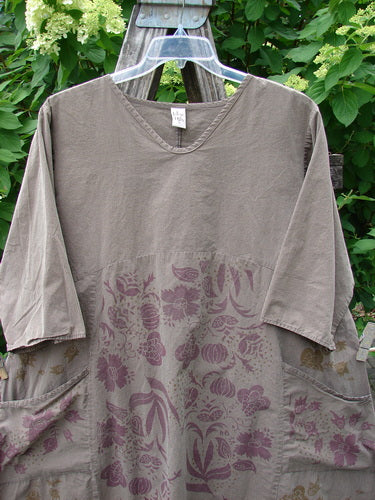 Barclay Percal Urchin Dress Climbing Garden Stripe Rock Size 0, featuring a loose fit with elbow-length sleeves, scooped neckline, and floral-patterned lower half, displayed outdoors on a wooden ladder.