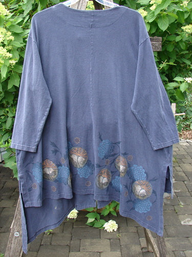 Barclay Single Button Painter's Jacket Moon Flower Deep Navy Size 3 features a unique asymmetrical hem, three-quarter sleeves, and a globe-flower motif, draped gracefully over an outdoor bench.