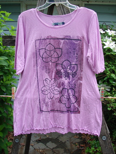 Barclay Slub Modal Three Quarter Sleeved Cafe Tee Lotus Pink Peony Size 0, featuring a rounded neckline, three-quarter sleeves, slight A-line flare, curly edges, and lotus flower paint, from BlueFishFinder.com.