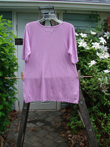 Barclay Slub Modal Three Quarter Sleeved Cafe Tee in Lotus Pink Peony, featuring a rounded neckline, three-quarter sleeves, curly edgings, and a lotus flower theme with a slightly flared hemline.