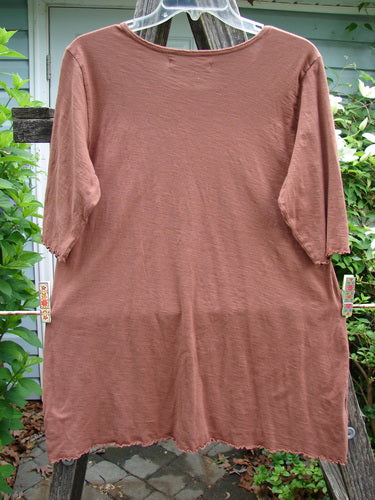 Barclay Slub Three Quarter A Lined Cafe Tee Unpainted Copper Size 1 features a rounded neckline, three-quarter sleeves, subtle flare, curly edgings, and a varying hemline, crafted from lightweight organic cotton.