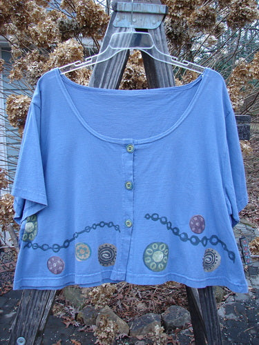 1993 Travel Top with Pinwheel Design, Periwinkle, Size 2: Crop-shaped blue shirt with chain and pinwheel theme paint, ceramic glazed buttons.