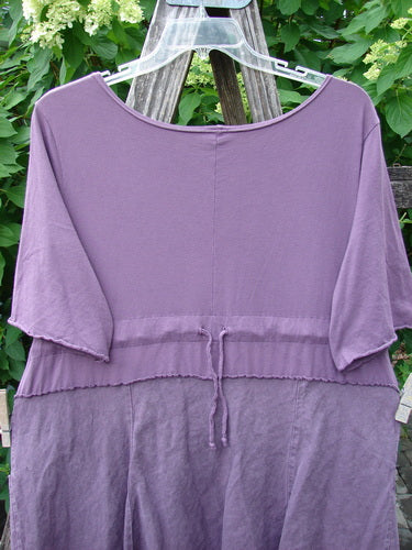 Barclay Linen Cotton Two Pocket Tie Back Square Dress Bloom Burst Plum Size 1 features a tunic-style design with a jersey knit top and crinkled lower half, complete with a waist drawstring.