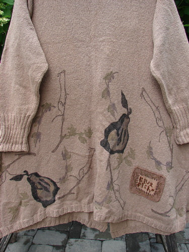 1998 Cotton Knit Canyon Cardigan Sweater Coat Pear Harvest Aspen OSFA, hanging outdoors, features a warm beige knit with botanical print near hem, ribbed cuffs, unique angled pockets, and a signature patch.