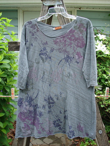 Barclay Viscose Three Quarter Sleeved Raw Cut Tee in Dusk Garden Grey Striation features a raw cut neckline, graduating A-line shape, and three-quarter sleeves, embodying Bluefishfinder.com's creative vintage style.