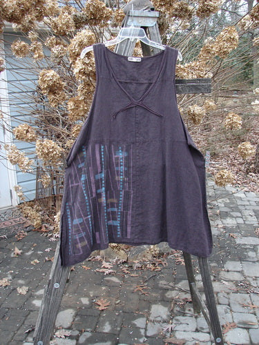 Barclay Linen Cross Over Pinafore Top Plaid Dark Plum Size 2 on wooden rack, featuring V-shaped neckline and sectional panels.