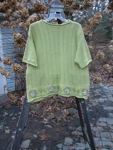 1999 Spring Pullover Tunic Sweater Kiwi Size 2: A green sweater with varied textures and knits, drop shoulders, and rolled neck sleeves.