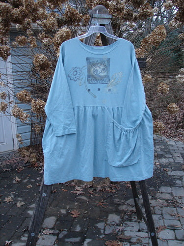 1995 Bric Brac Dress with flower and swirl theme, featuring oversized pocket and sweet bottom flounce, adorned by Blue Fish patch. Size 1.