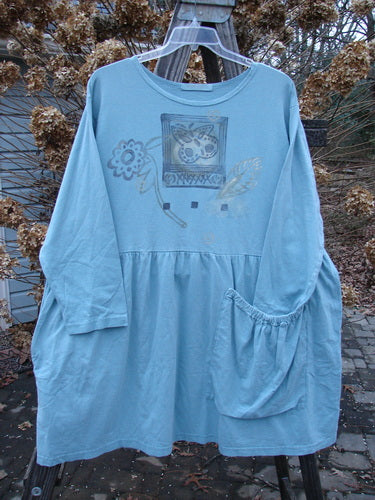Blue Fish Bric Brac Dress with flower and swirl theme, oversized pocket, flounce, drop waist, and signature patch. Size 1, watercolor design.