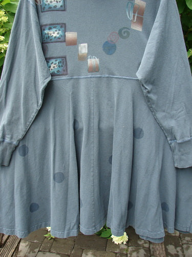 1996 Enchantment Dress Polka Path Mirror Size 2: Slate-blue knit tunic with abstract beige, brown, and teal designs. Features include a ribbed turtleneck, empire waist seam, flared mid-calf skirt, and deep side pockets.