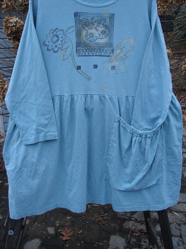 1995 Bric Brac Dress with Flower Watercolor design, size 1. Features flared lower, oversized pocket, and signature Blue Fish Patch.