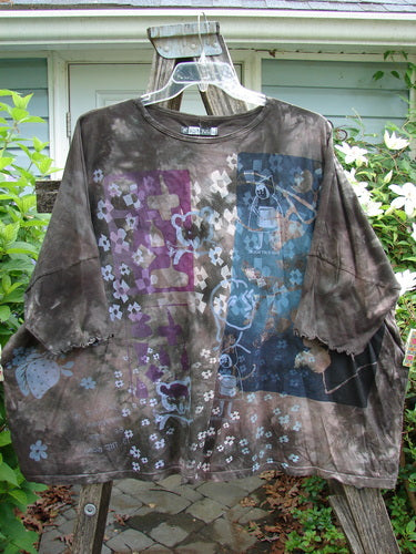 Barclay Crop Wide Dolman Curly Edge Tee My Book Mottled Earth OSFA features a rounded, rolled neckline, short dolman sleeves, wide boxy shape, crop length, and curly sleeve edges.