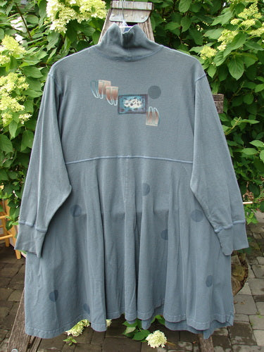 1996 Enchantment Dress Polka Path Mirror Size 2: Loose-fitting, slate-grey tunic with long sleeves, mock-turtleneck, dropped-waist seam, flared skirt, circular-spot pattern, abstract chest graphic, showcasing Bluefishfinder's vintage style.