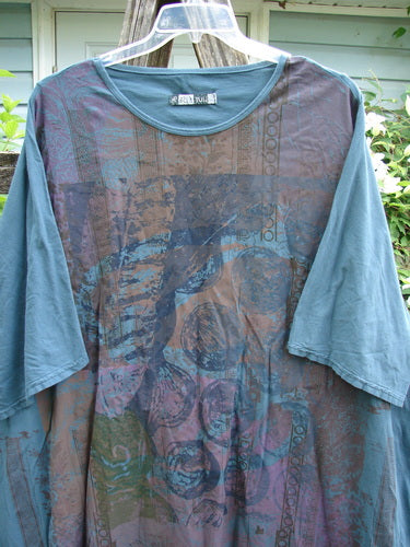 Barclay Art Tunic Stone Garden Mottled Green Mineral OSFA features a tunic length, drop shoulders, loose three-quarter sleeves, rounded neckline, varying hemline, and distinctive vertical Victorian gate theme paint.