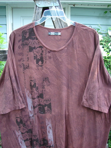 Barclay Tournesol Tunic in Mottled Burgundy, featuring a tunic length, drop shoulders, three-quarter sleeves, and side garden motif, exemplifying BlueFishFinder's vintage style and creative expression in organic cotton.