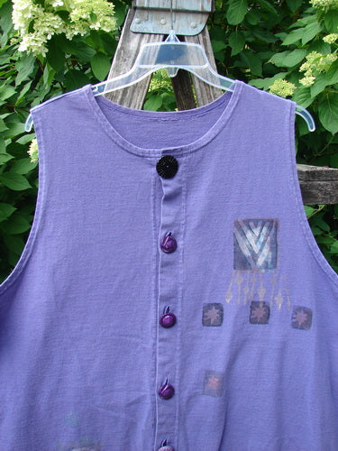 1996 Symbol Vest Star Rain Byzantium Size 2, a sleeveless lilac top with a button-front design, featuring a decorative black button at the neckline and a signature Blue Fish patch on the chest.