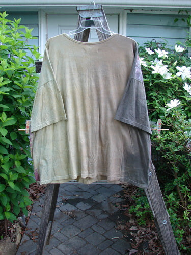 Barclay Short Sleeved Center Seam Square Pullover Garden Friends Mottled Mustard OSFA features a boxy, slightly cropped silhouette with a rolled neckline and dolman sleeves, highlighting its artistic vertical center seam design.