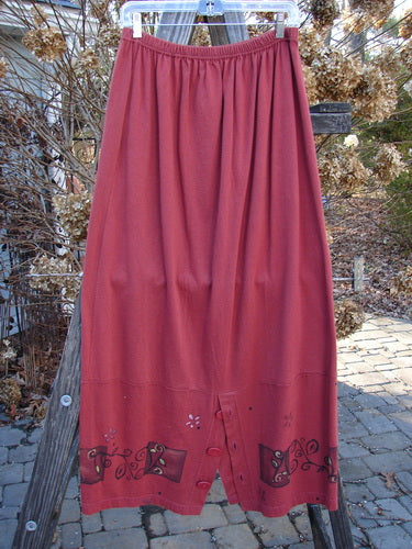 1997 Hearth Peplum Button Duo Vines Brick Size 2: A red skirt with a design on it, standing on a pole.