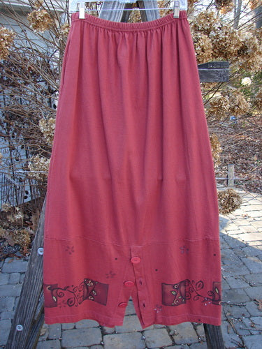 1997 Hearth Peplum Button Duo Vines Brick Size 2: A red skirt with a design on it, paired with a matching jacket.