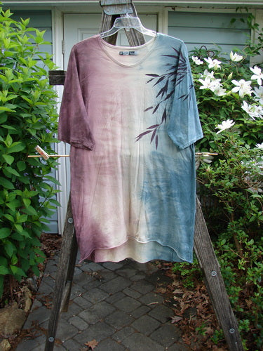 Barclay Tournesol Slim Tunic Bamboo Leaf Mottled Dusk OSFA showcases a mid-length design with drop shoulders, loose three-quarter sleeves, and a rounded neckline, featuring a bamboo leaf motif and varying hemline.