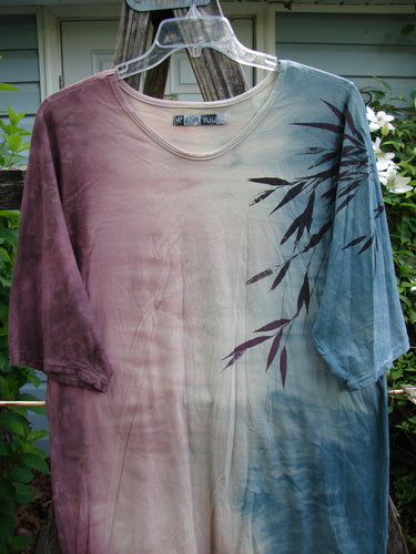 Barclay Tournesol Slim Tunic Bamboo Leaf Mottled Dusk OSFA, featuring a relaxed fit with drop shoulders, three-quarter sleeves, and a rounded neckline, showcasing a bamboo leaf motif on an earthen backdrop.