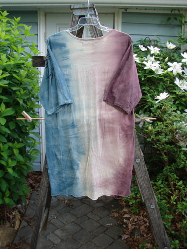 Barclay Tournesol Slim Tunic Bamboo Leaf Mottled Dusk OSFA features a mid-length design with drop shoulders, rounded neckline, and three-quarter sleeves, showcasing a bamboo leaf pattern on a mottled backdrop.