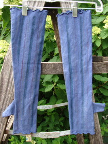 Barclay Cotton Lycra Hemp Fingerless Glove Stripe Royal Orchid OSFA, featuring thumb-hole flaps and ruffled edges, hangs on a plastic hanger, highlighting its elegant flattened edgings and cozy, mid-weight fit.