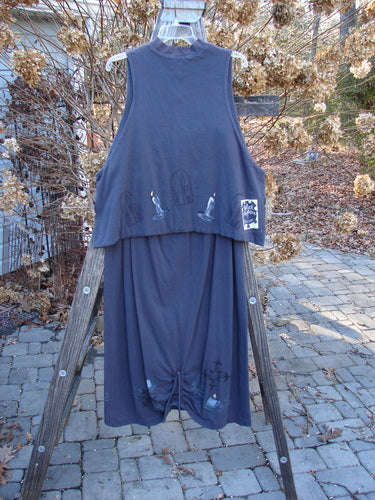 1999 Mandarin Winter Duo Celtic Candle Raven Size 2: Blue dress on wooden ladder, Asian-inspired mock T neck, double-lined vest with Celtic candle theme paint, and blue fish patch. Matching winter skirt with scooped front hemline and pegged shape.