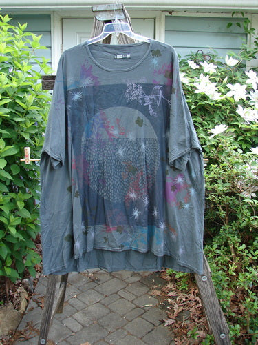 Barclay Art Tee Circle Of Life Mottled Green Teal OSFA features a tunic-length style with drop shoulders, loose three-quarter sleeves, a rounded neckline, and an upward rounded front hem.