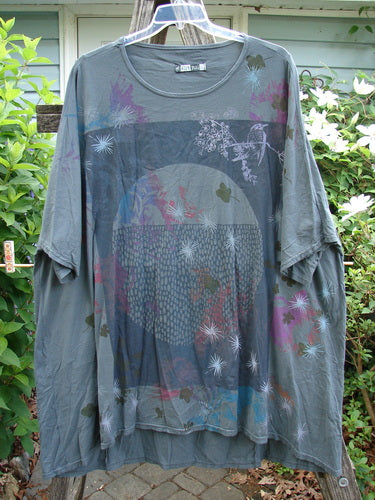 Barclay Art Tee Circle Of Life Mottled Green Teal OSFA features a tunic length with drop shoulders, loose three-quarter sleeves, and a rounded neckline, accented by a unique hemline design.