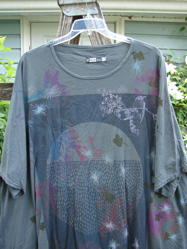 Barclay Art Tee Circle Of Life Mottled Green Teal OSFA features a tunic length, drop shoulders, three-quarter sleeves, rounded neckline, varying hemline, and artistic motifs, embodying Bluefishfinder.com's creative vintage style.