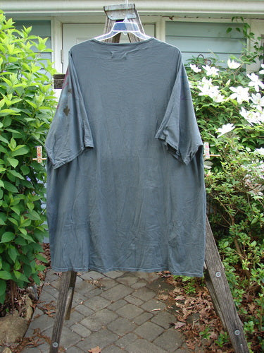 Barclay Art Tee Circle Of Life in mottled green teal, features a tunic length, drop shoulders, loose three-quarter sleeves, rounded neckline, and varying hemline, embodying BlueFishFinder's vintage style.