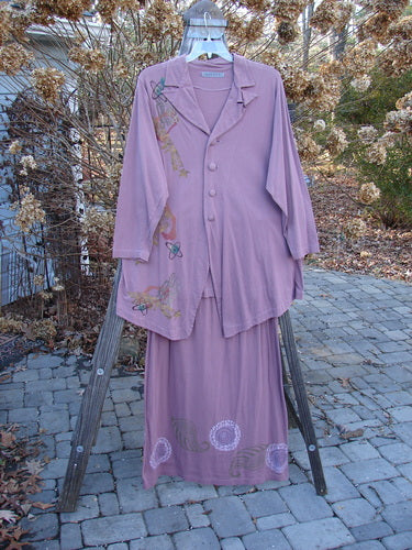 1996 Boulevard Festival Duo Laurel Size 1: Pink dress on wooden stand with purple shirt design.