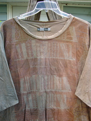 Barclay Raw Edge Flutter Collar High Low Top showcases a rounded batiste neckline, raw edge dolman sleeves, boxy shape, and hi-low hemline, embodying Bluefishfinder.com's vintage creative ethos.