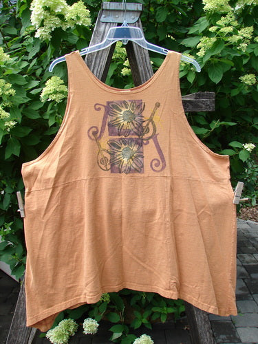 1994 Short Simple Smock Double Daisy Oro Size 1: A sleeveless, loose-fitting tank top with dual sunflower panels, hanging on a rustic ladder amidst leafy greenery, embodying Bluefishfinder.com's vintage charm.